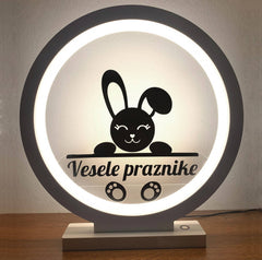 Bela ambientalna LED svetilka z menjajočimi motivi – vesele praznike