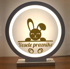 Bela ambientalna LED svetilka z menjajočimi motivi – vesele praznike